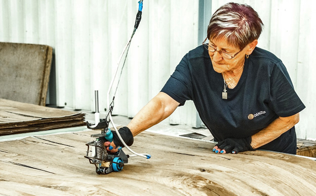A specialist operator working at the multi-specialty splicing facility for custom wood orders.